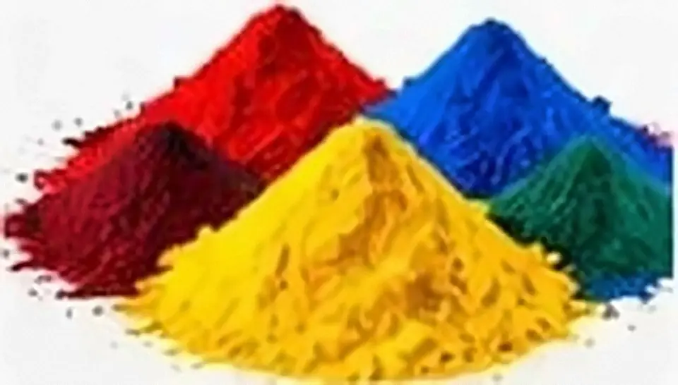 Heaps of red, yellow, blue and green pigment powder